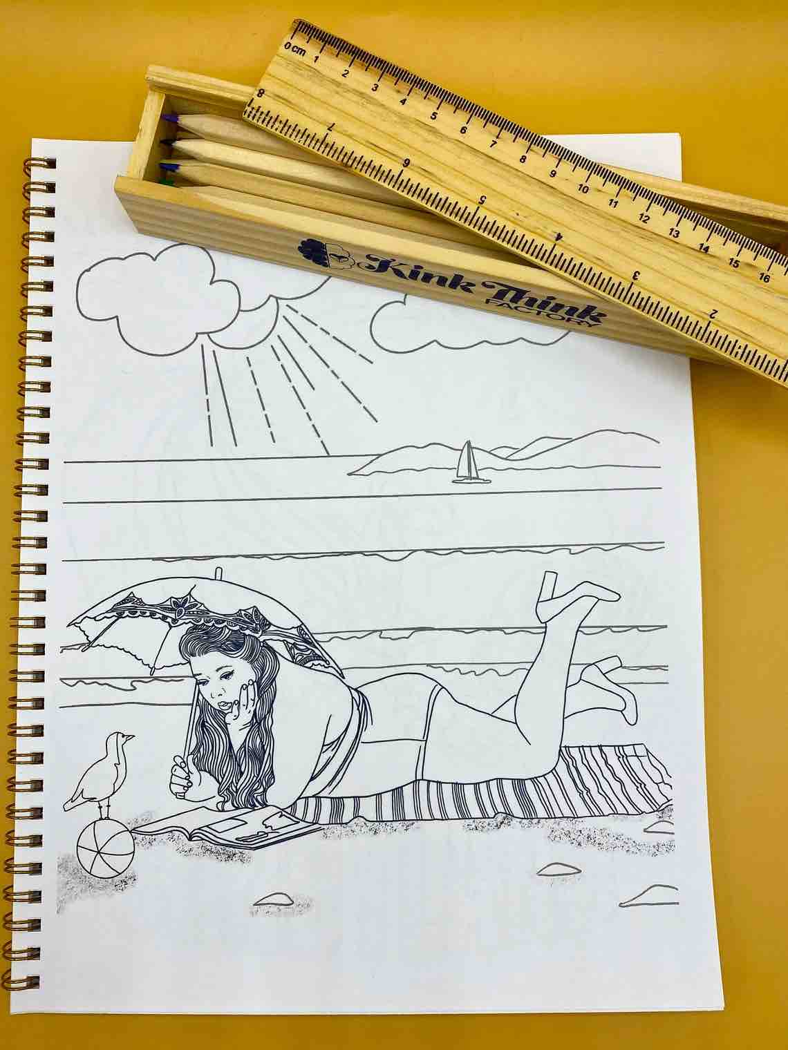 A page from Naughty and Nice: A Coloring Book for Babygirls: A plus size girl in a bathing suit holding a parasol lying on a striped towel on the beach.