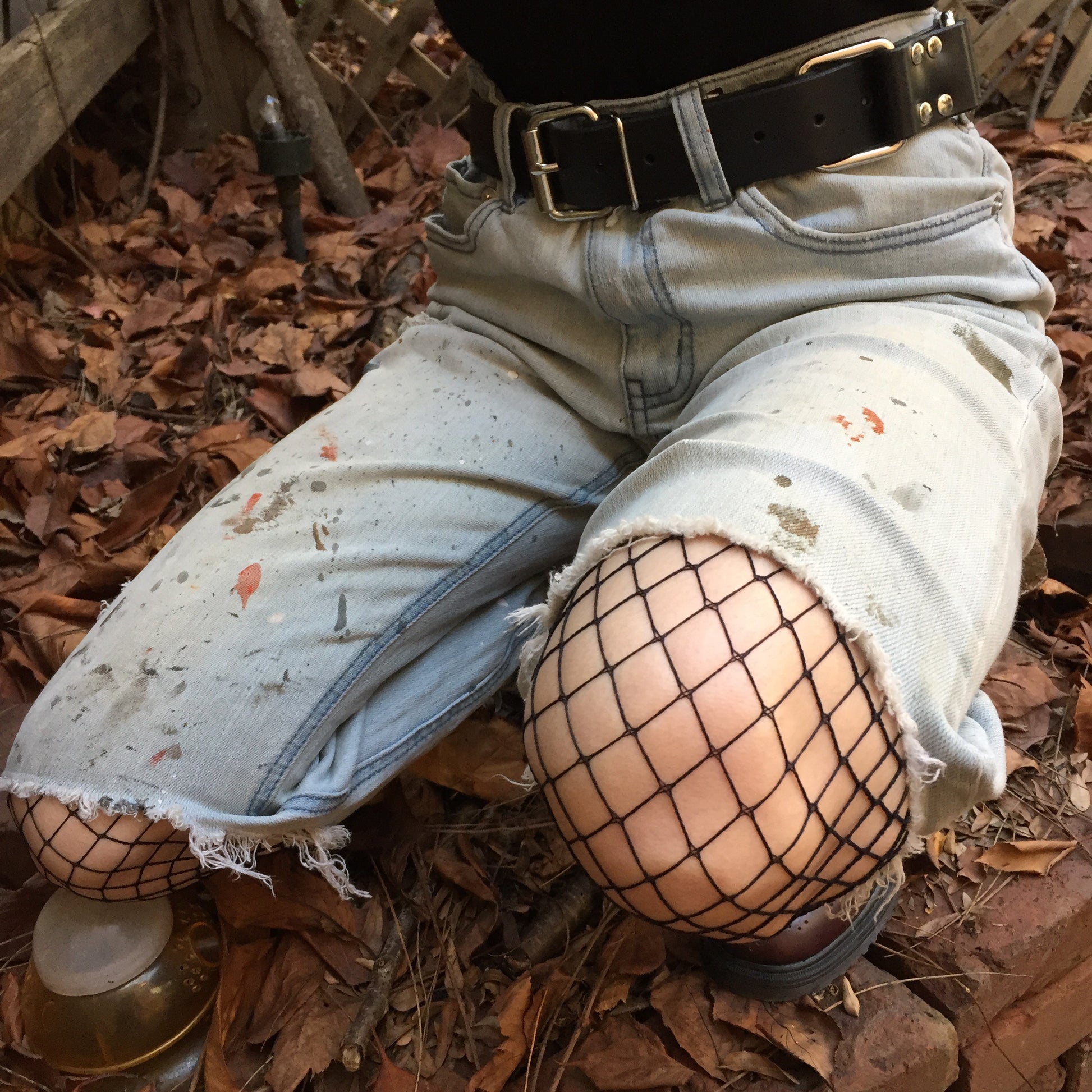 Spandex Industrial Net Pantyhose in black, closeup of knee under jean shorts.