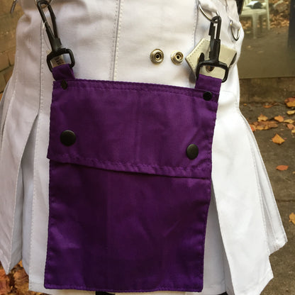 A model wearing the purple Detachable Pocket for Heritage Kilt hooked to their kilt D-rings.