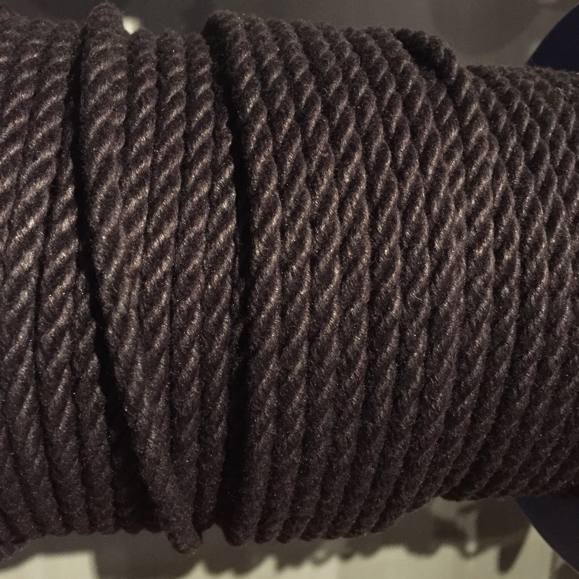 A spool of grey POSH Colorfast Synthetic Hemp Jute Rope.
