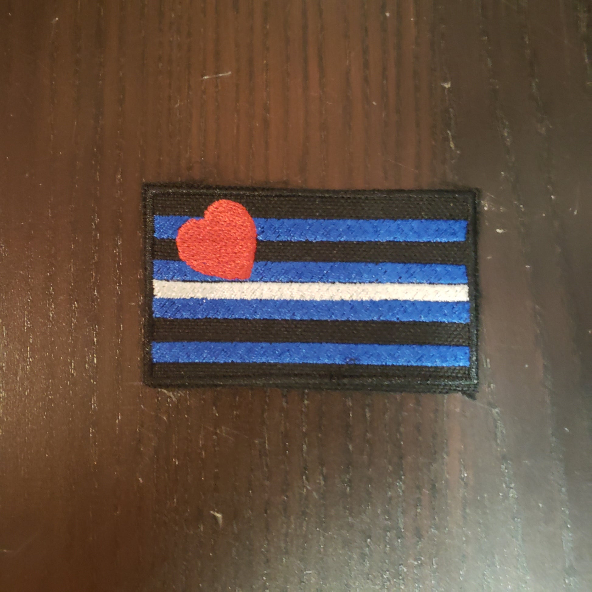 The Leather Flag Leather Bar Lapel Patch.