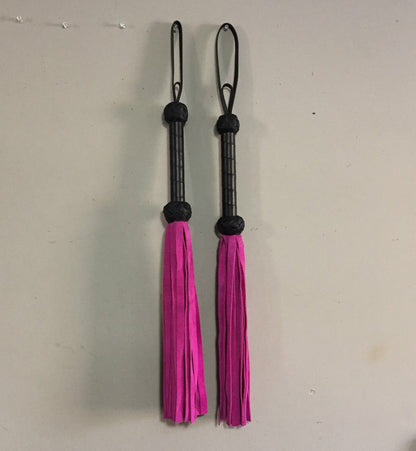 A pair of hot pink Basic Suede Flogger.