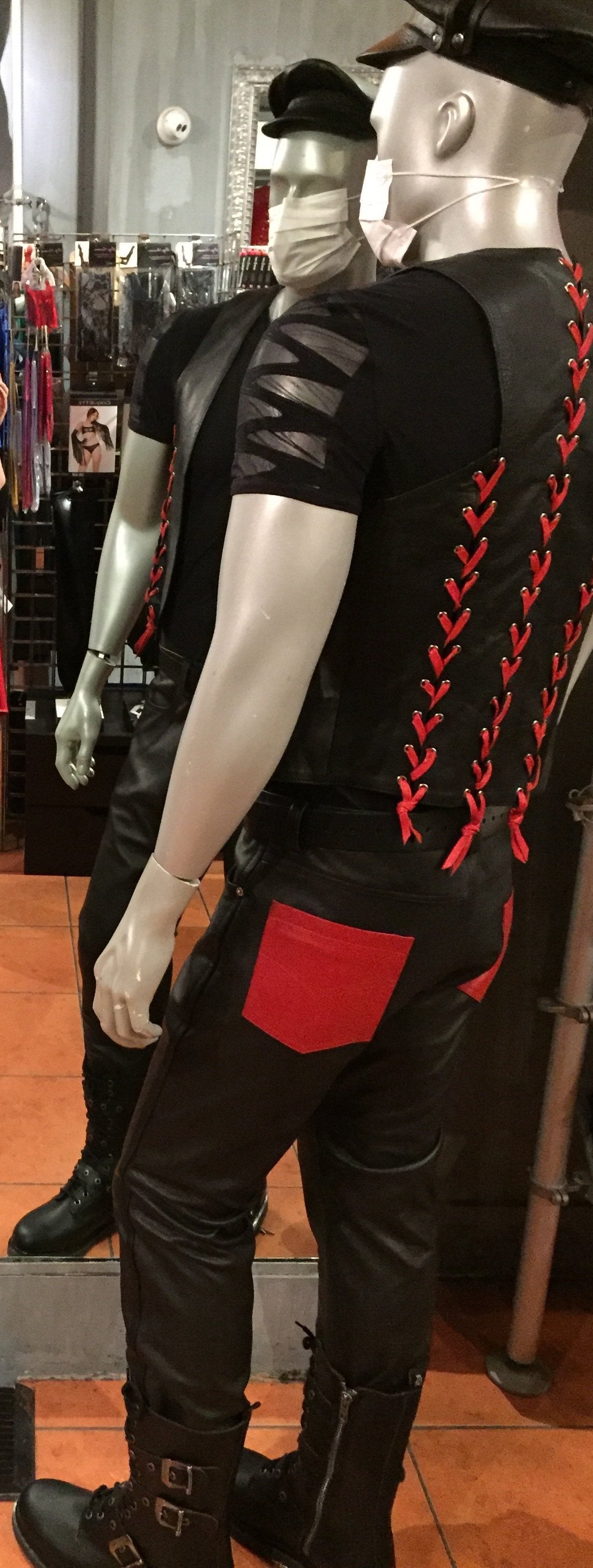 A mannequin displaying the back of the Cowhide Levi Jeans with red pocket.