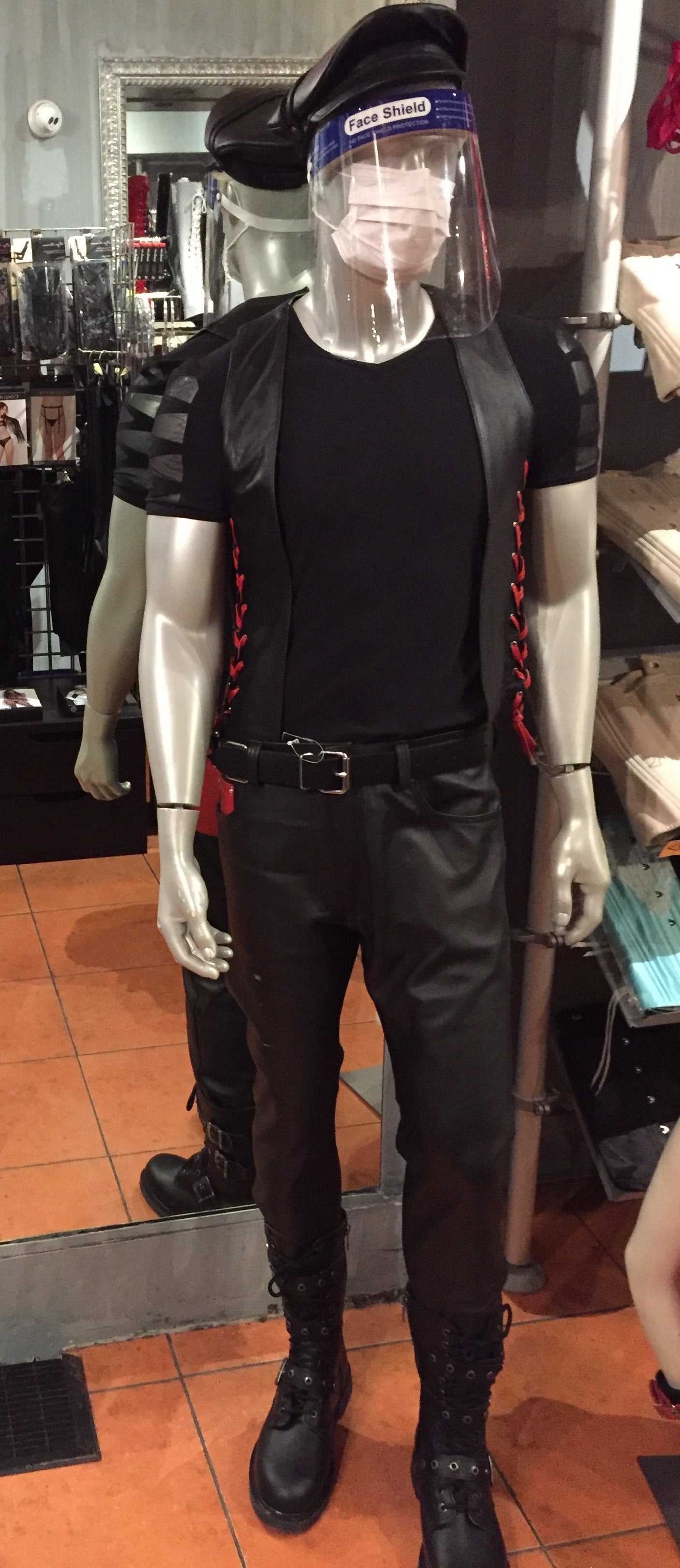 A mannequin displaying the front of the Cowhide Levi Jeans with red pocket.