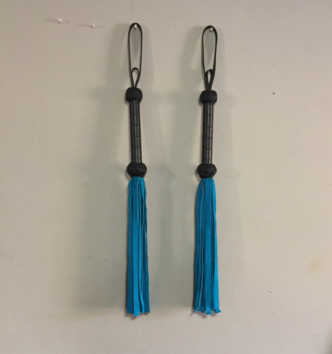 A pair of Teal Basic Suede Floggers.