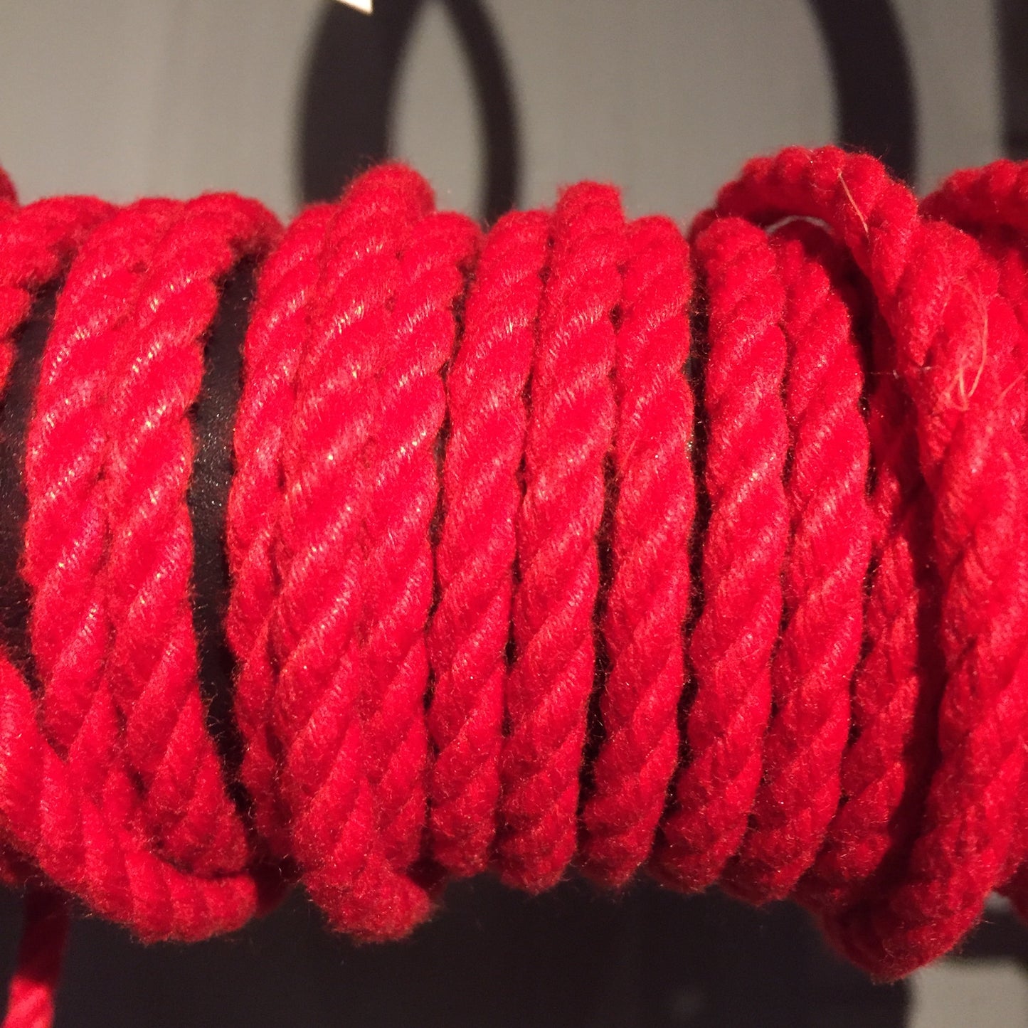 A spool of red POSH Colorfast Synthetic Hemp Jute Rope.