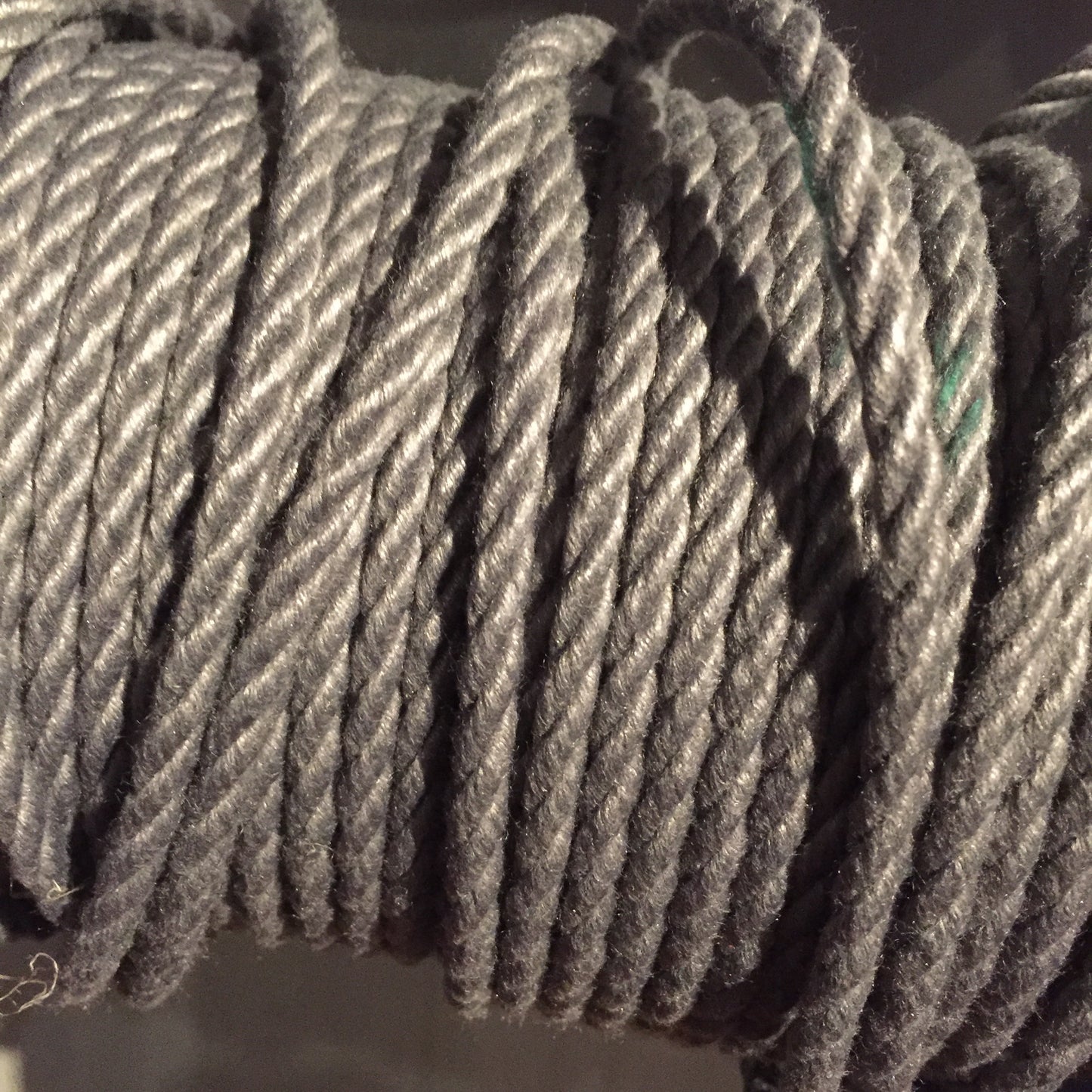 A spool of grey POSH Colorfast Synthetic Hemp Jute Rope.