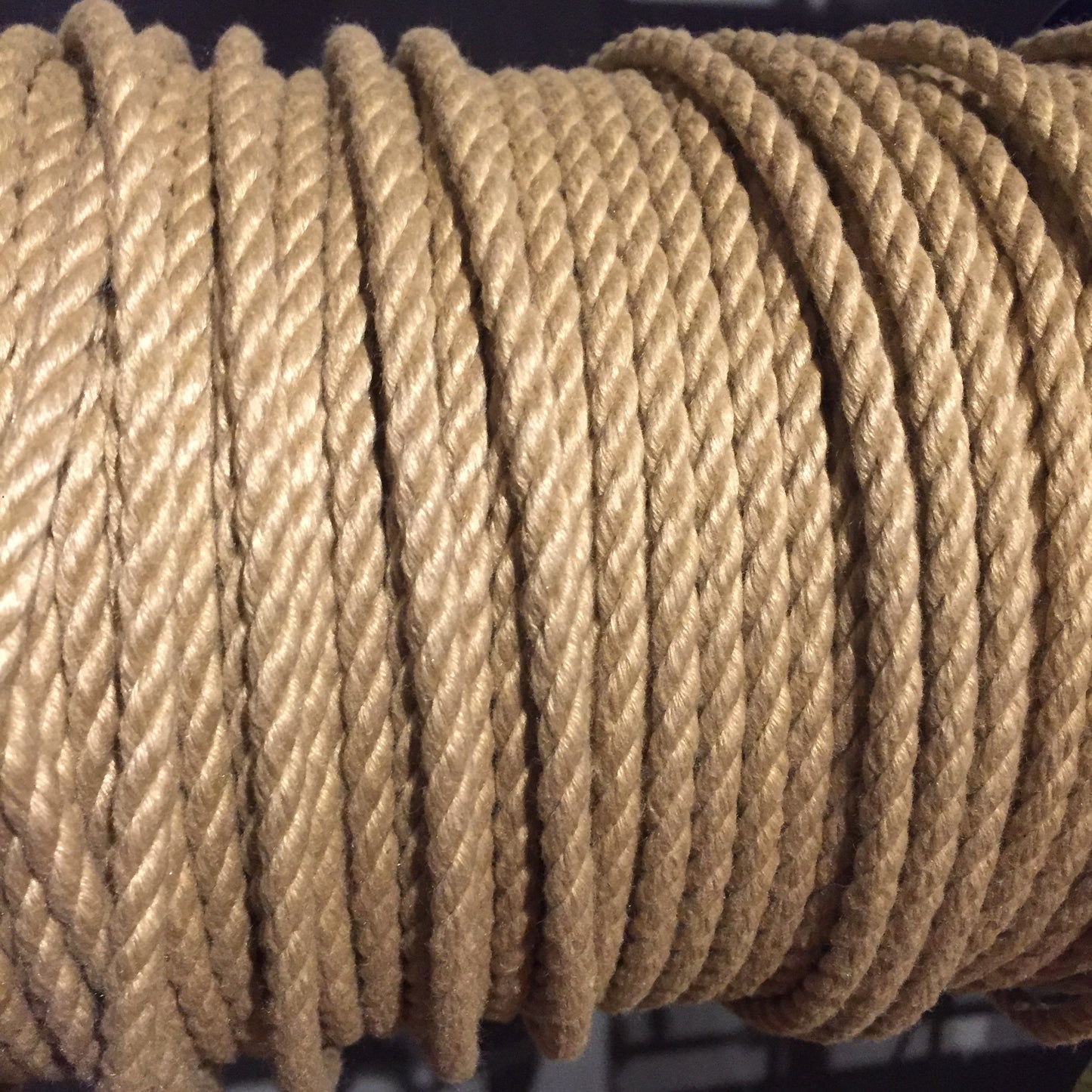 A spool of tan POSH Colorfast Synthetic Hemp Jute Rope.