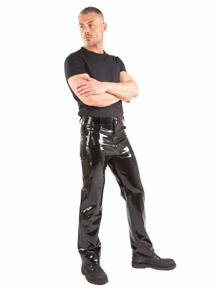A model wearing a black t-shirt and the Latex Jeans with Front & Back Pockets, front view.