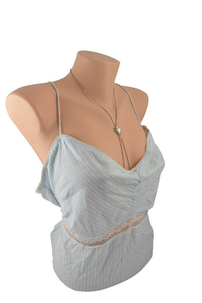 The Filigree Heart Stainless Steel Nipple Chain Necklace on a mannequin wearing a blue camisole. 