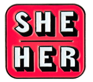 SHE/HER pink background with white lettering enamel pronoun pin