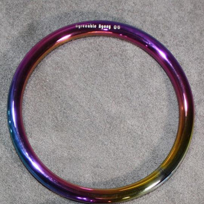  A rainbow colored steel suspension ring.