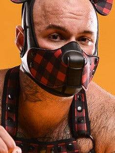 A model wearing the red plaid neoprene snap-on K9 muzzle with the Neoprene K-Hood Base, matching ears and harness.