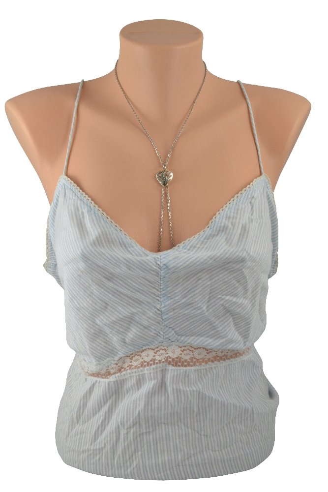 The Filigree Heart Stainless Steel Nipple Chain Necklace on a mannequin wearing a blue camisole. 