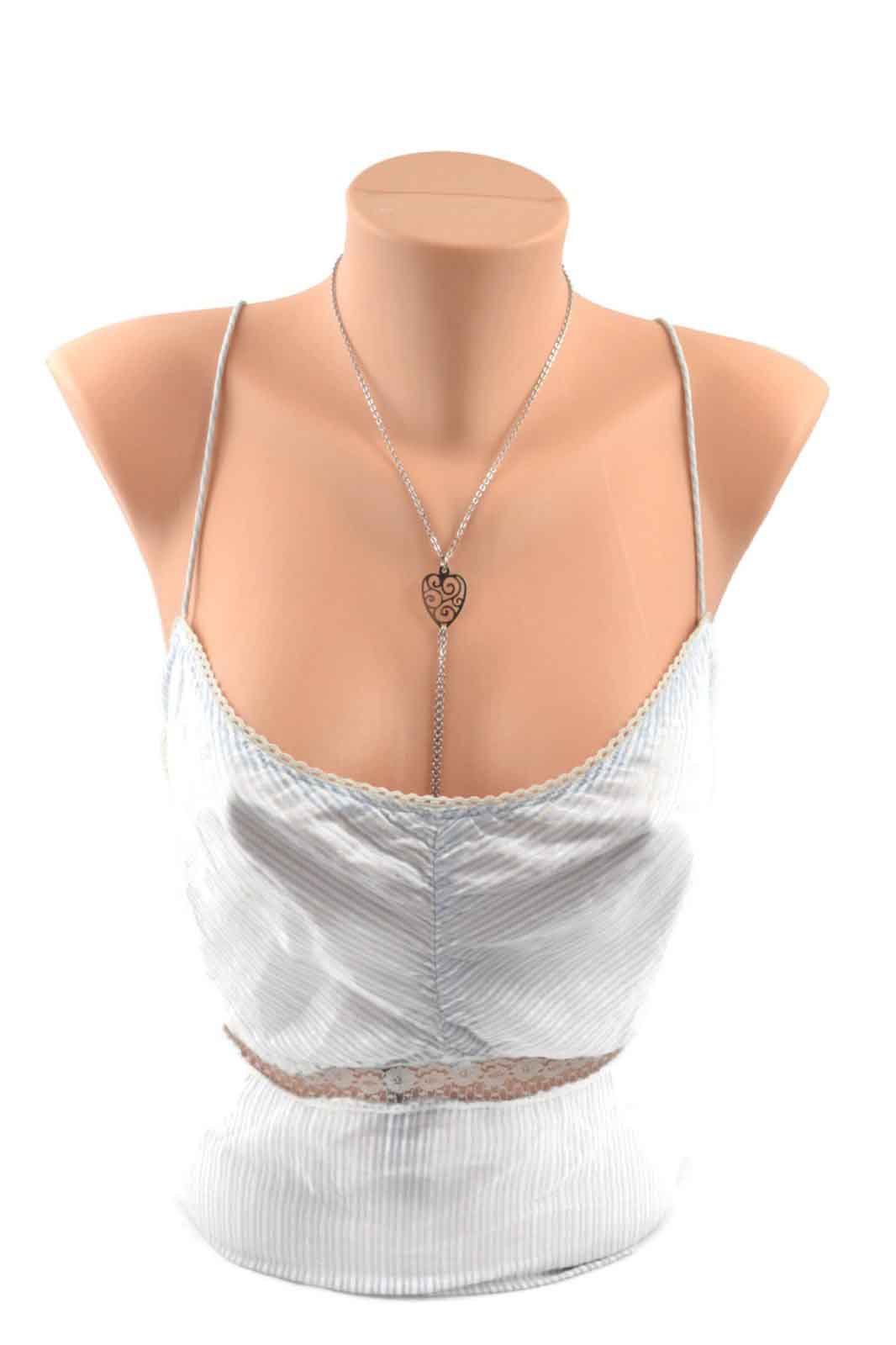 The Unchained Heart Collar with Nipple Chain on a mannequin wearing a silver camisole.