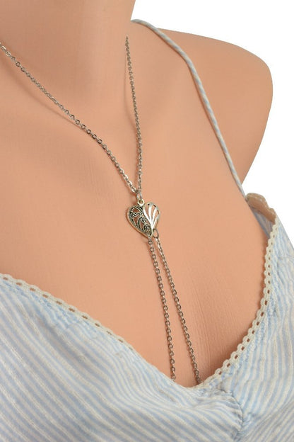 The Filigree Heart Stainless Steel Nipple Chain Necklace on a mannequin wearing a blue camisole. 