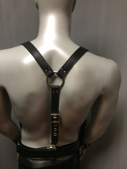 Rear view of the Suspenders on mannequin wearing leather pants and leather armbands.