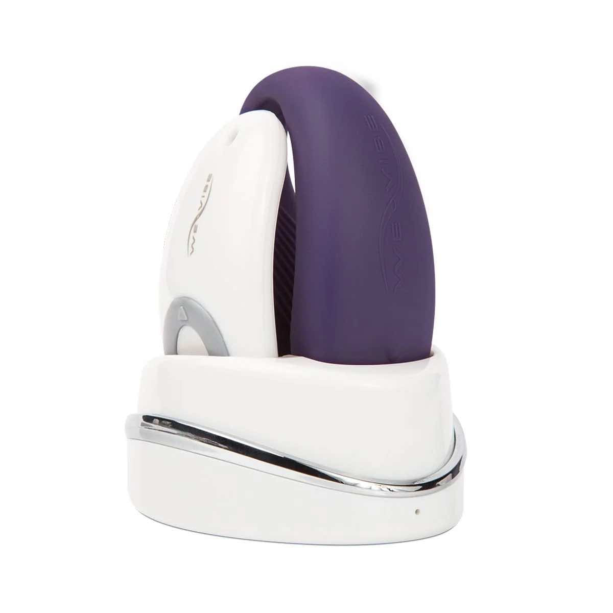 The purple We-Vibe Sync with its remote and charging base.
